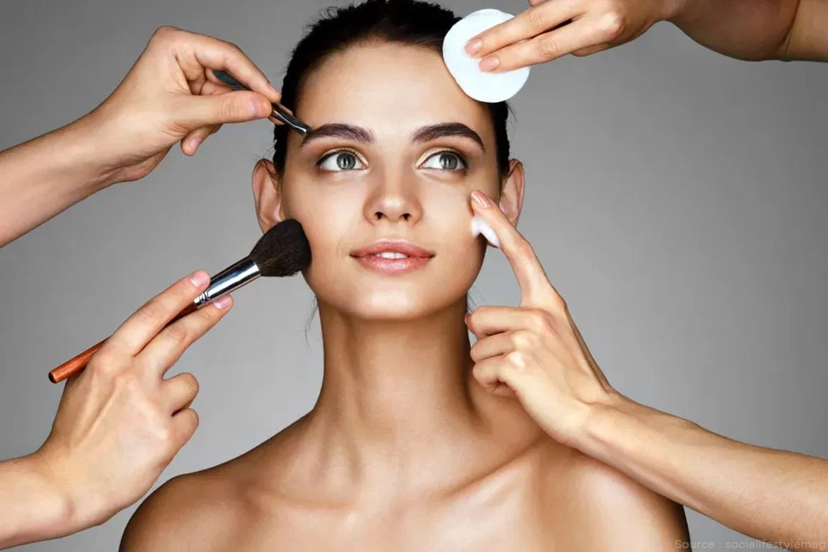 Makeup artist applying cosmetics during a personal grooming session